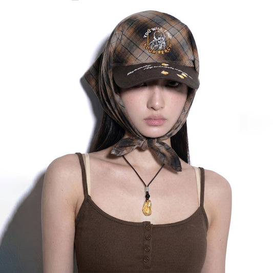 Model wearing REDRINSE FIREFLY plaid bandana hat tied under the chin