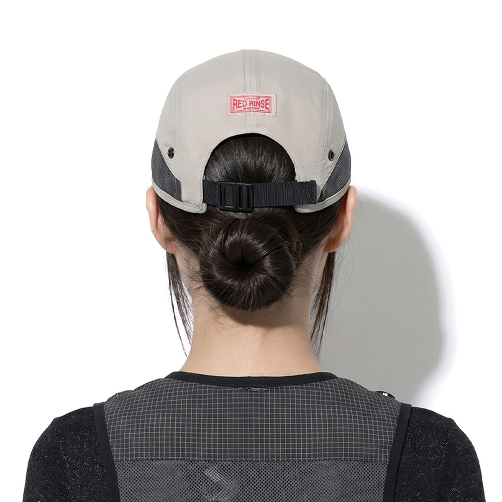 Model wearing REDRINSE ATHLETE outdoor cap, back view