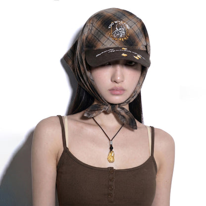 Model wearing REDRINSE FIREFLY plaid bandana hat tied under the chin