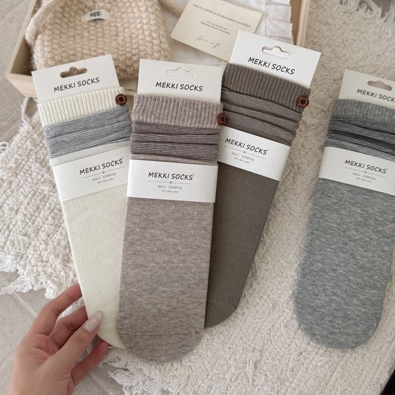 Four neutral ribbed combed cotton socks with striped cuffs