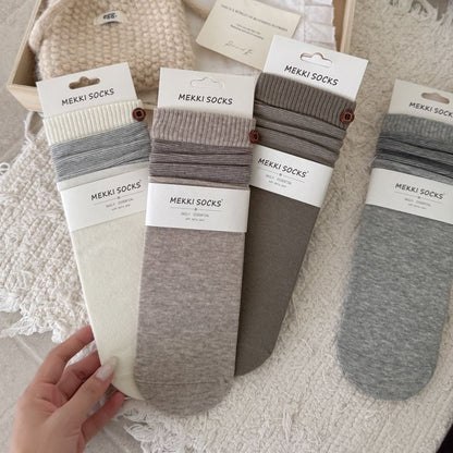 Four neutral ribbed combed cotton socks with striped cuffs
