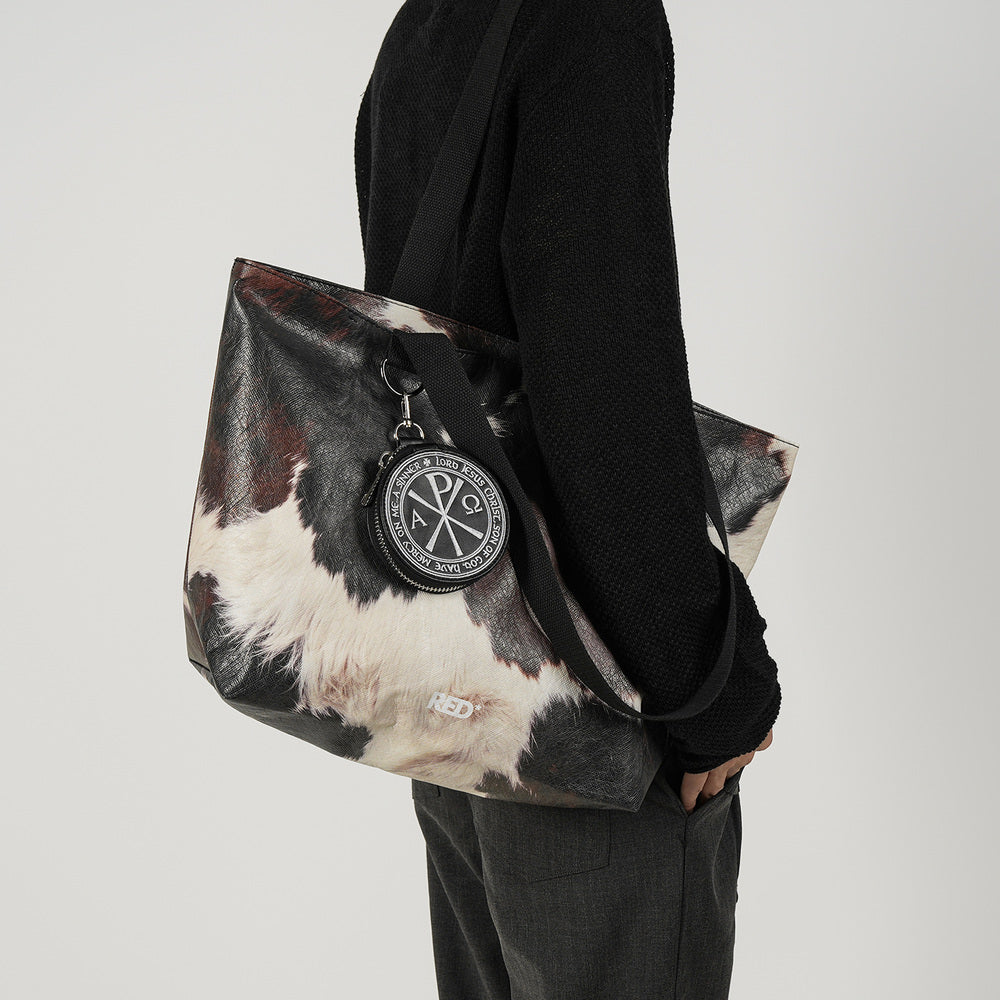 EMBER cow print Tyvek tote bag side styling view