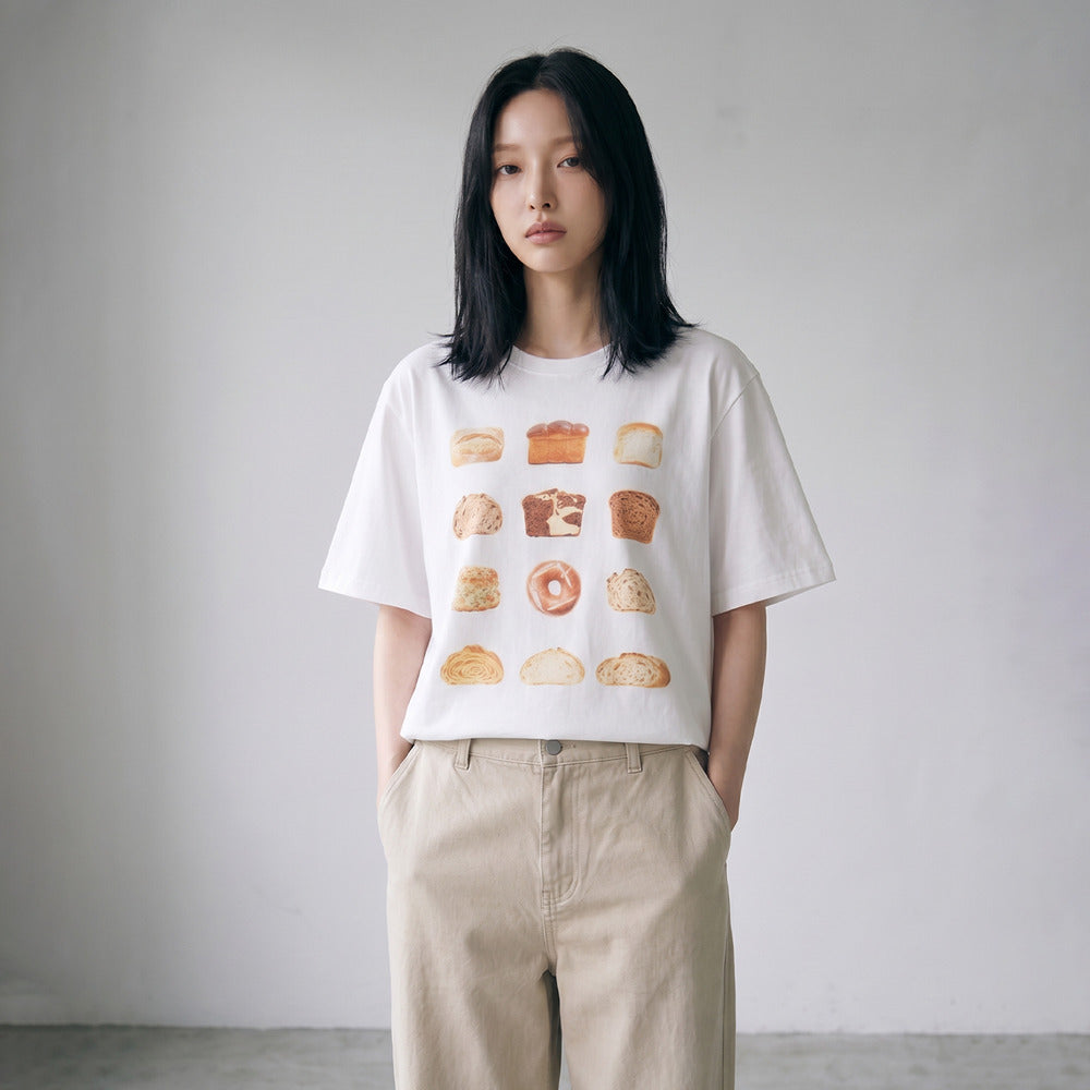 Model wearing LOAF vintage bread print white T-shirt, front view
