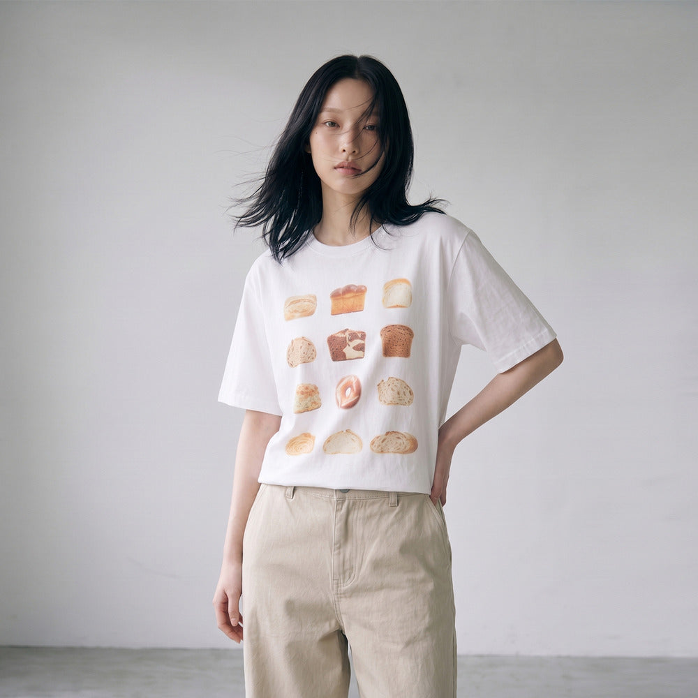 Model wearing LOAF bread print slub cotton T-shirt, relaxed pose