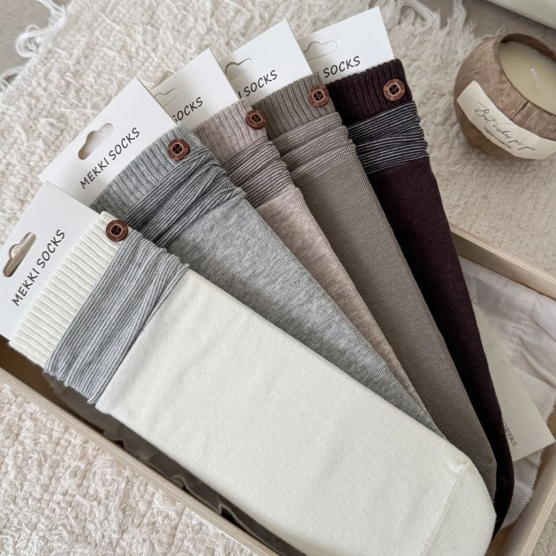 Seven neutral and coffee-tone ribbed sock colorways