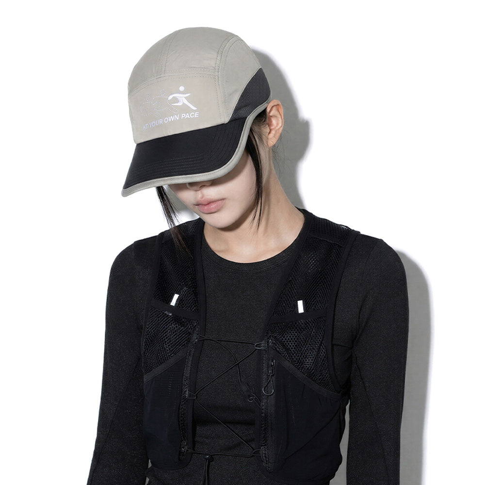 Model wearing REDRINSE ATHLETE outdoor cap, downward front view
