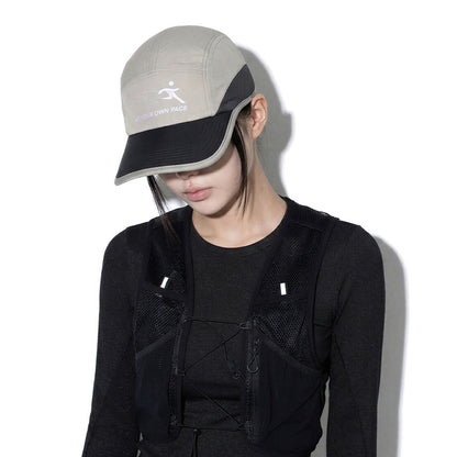 Model wearing REDRINSE ATHLETE outdoor cap, downward front view