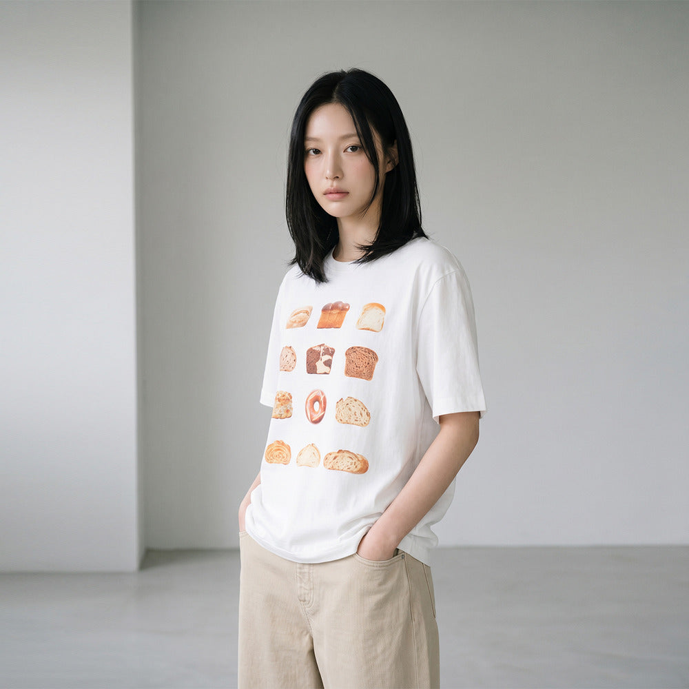 Model wearing LOAF white graphic T-shirt, three-quarter view