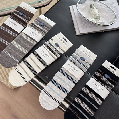 CHARM original five-color button-detail sock flat lay
