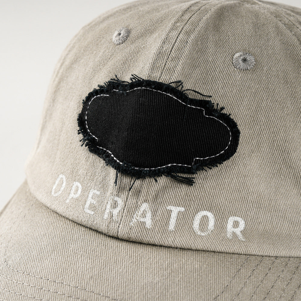 REDRINSE OP baseball cap raw-edge black patch and OPERATOR lettering detail