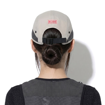 Model wearing REDRINSE ATHLETE outdoor cap, back view