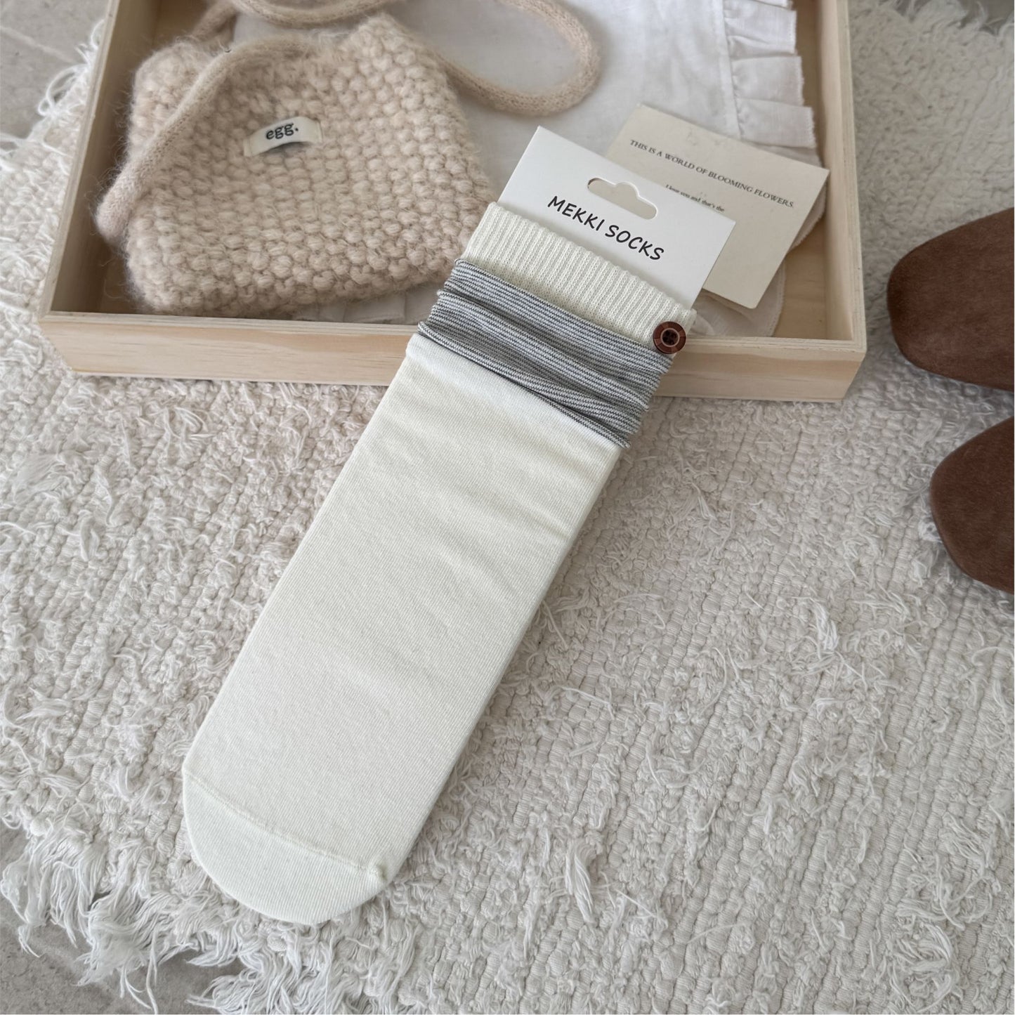 Ivory ribbed sock with a contrast striped cuff