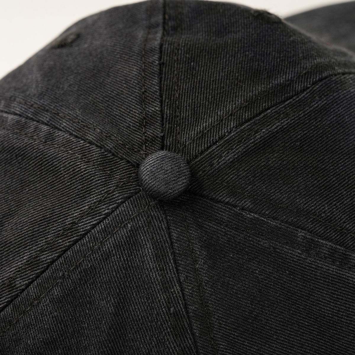 SUNBURN cap crown button and panel detail