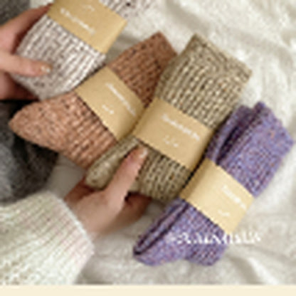 Seven flecked wool-blend socks in warm seasonal colors