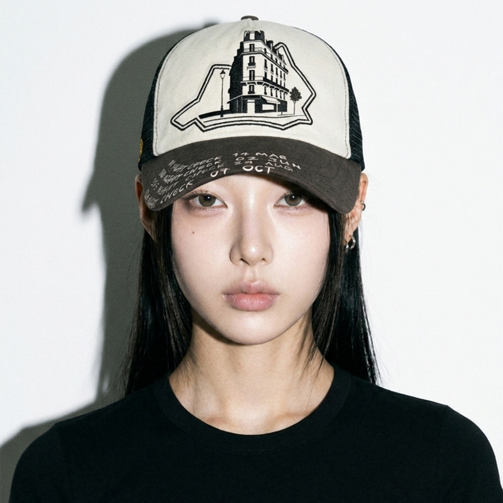 Close front view of model wearing the LOUNGE trucker hat