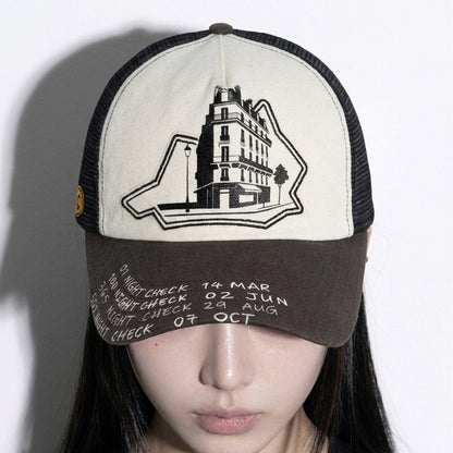 Close-up of the LOUNGE trucker hat embroidered front and printed brim