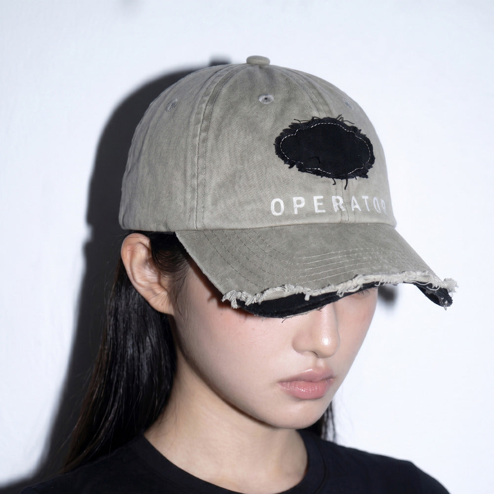Model wearing REDRINSE OP distressed washed baseball cap three-quarter view