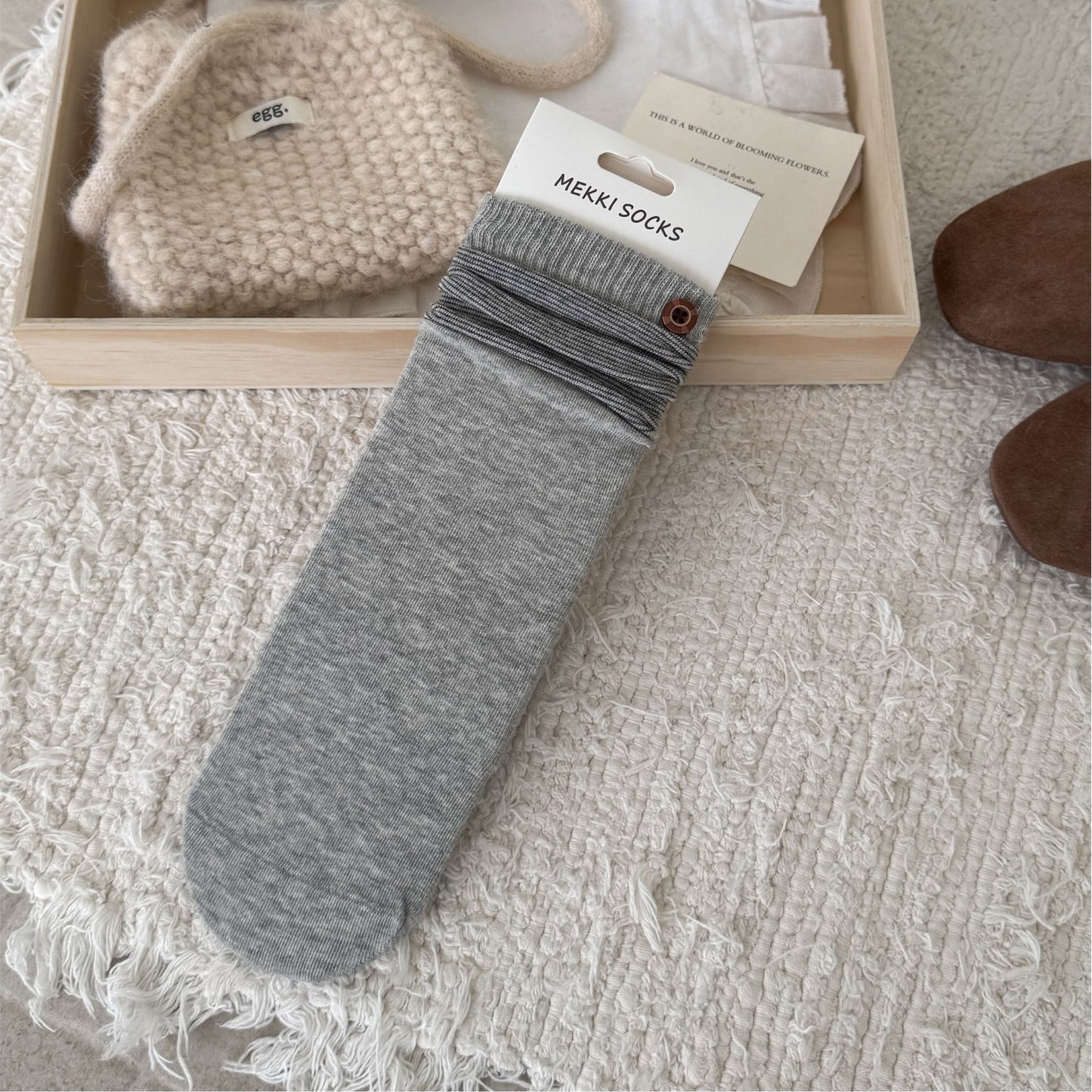 Light grey ribbed sock with a contrast striped cuff