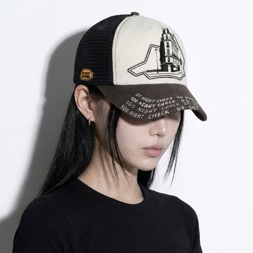 Model wearing the LOUNGE trucker hat in three-quarter view