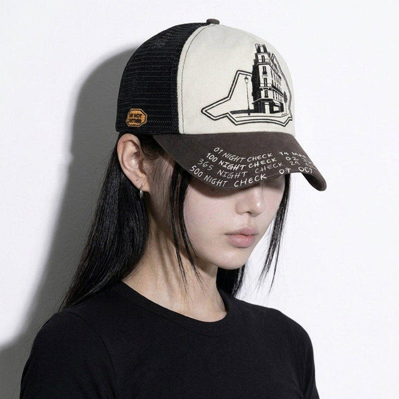 Model wearing the LOUNGE trucker hat in three-quarter view