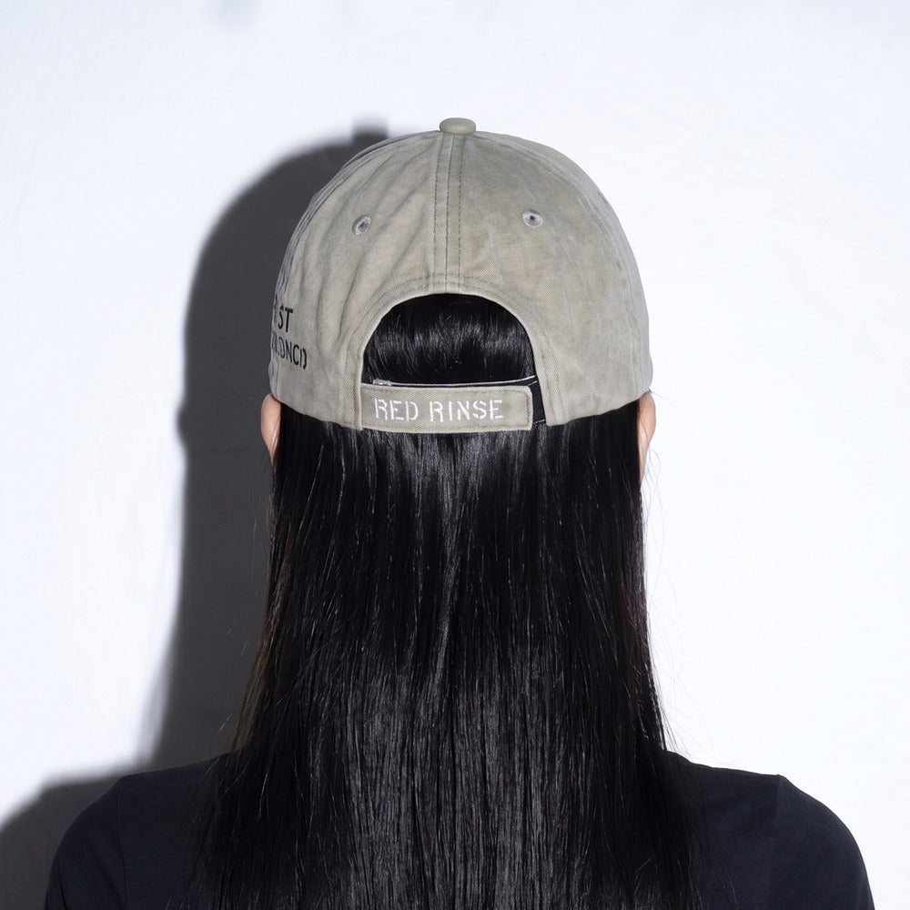 Model wearing REDRINSE OP distressed washed baseball cap back view