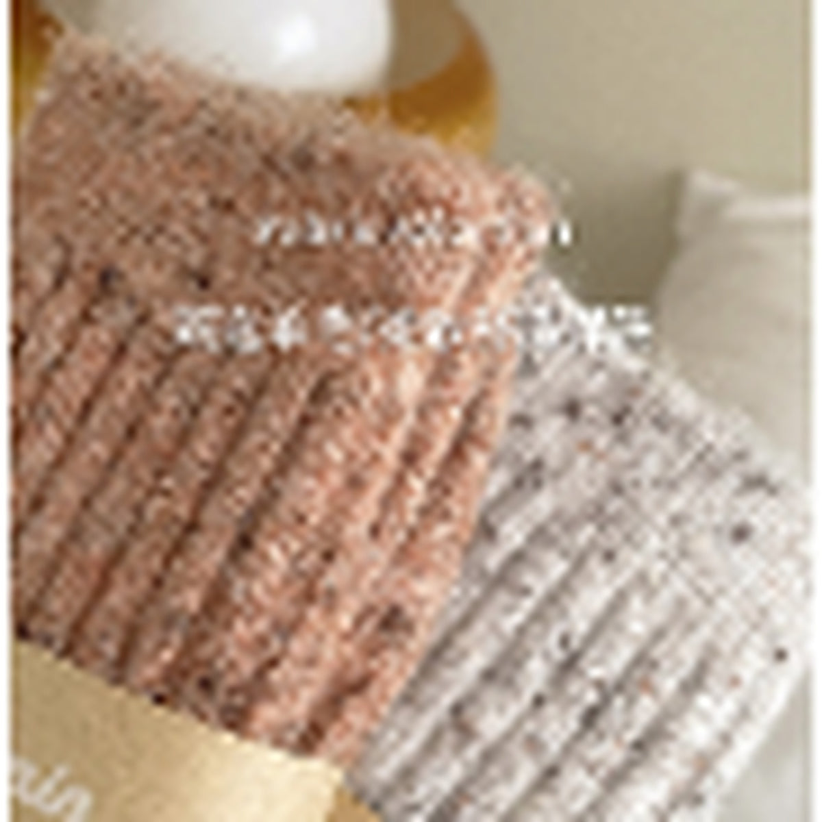 Close-up of the soft flecked wool-blend knit texture