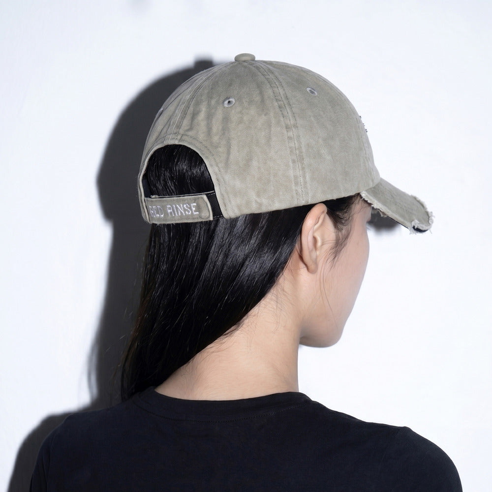 Model wearing REDRINSE OP distressed washed baseball cap rear angled view