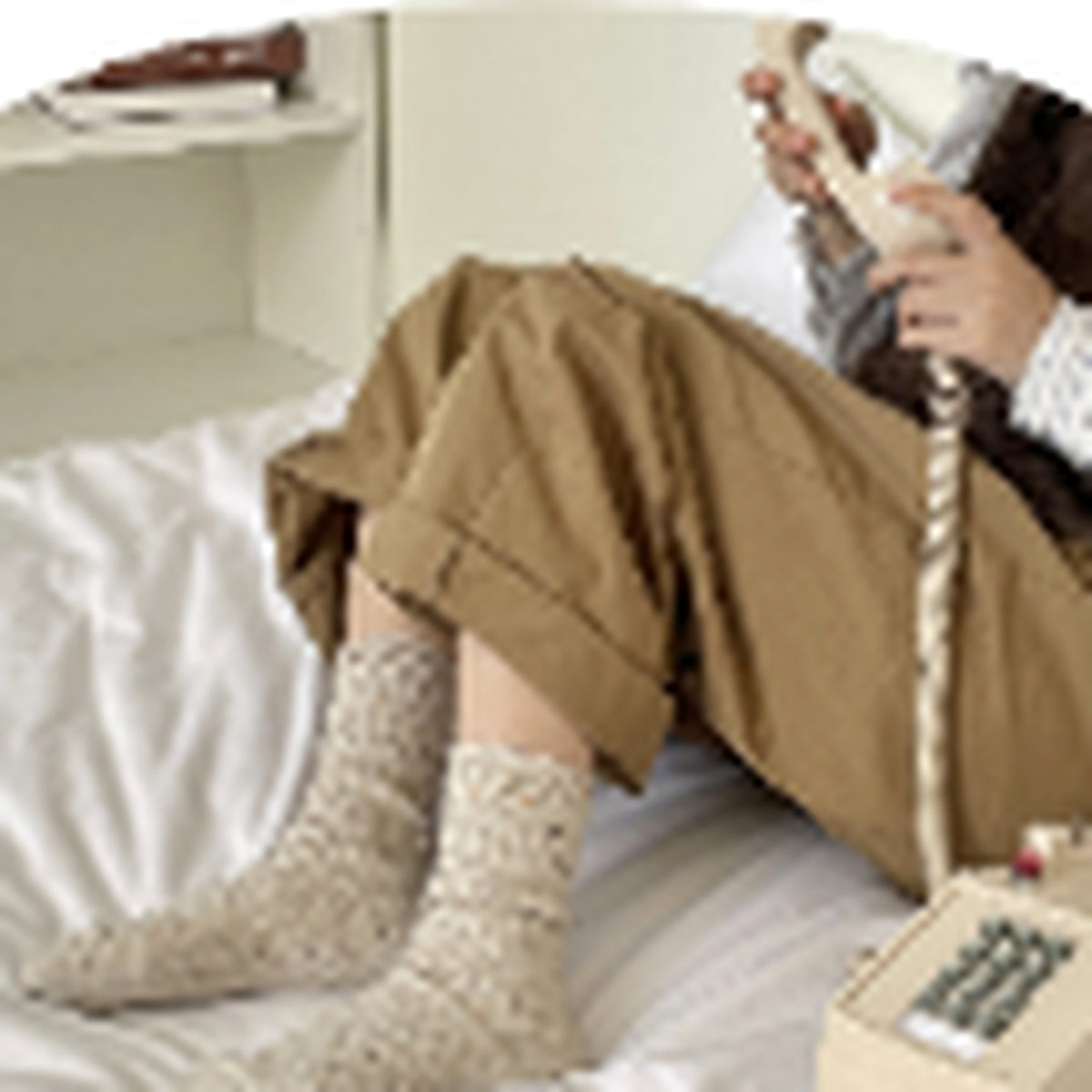 Ivory flecked mid-calf socks worn in a relaxed setting