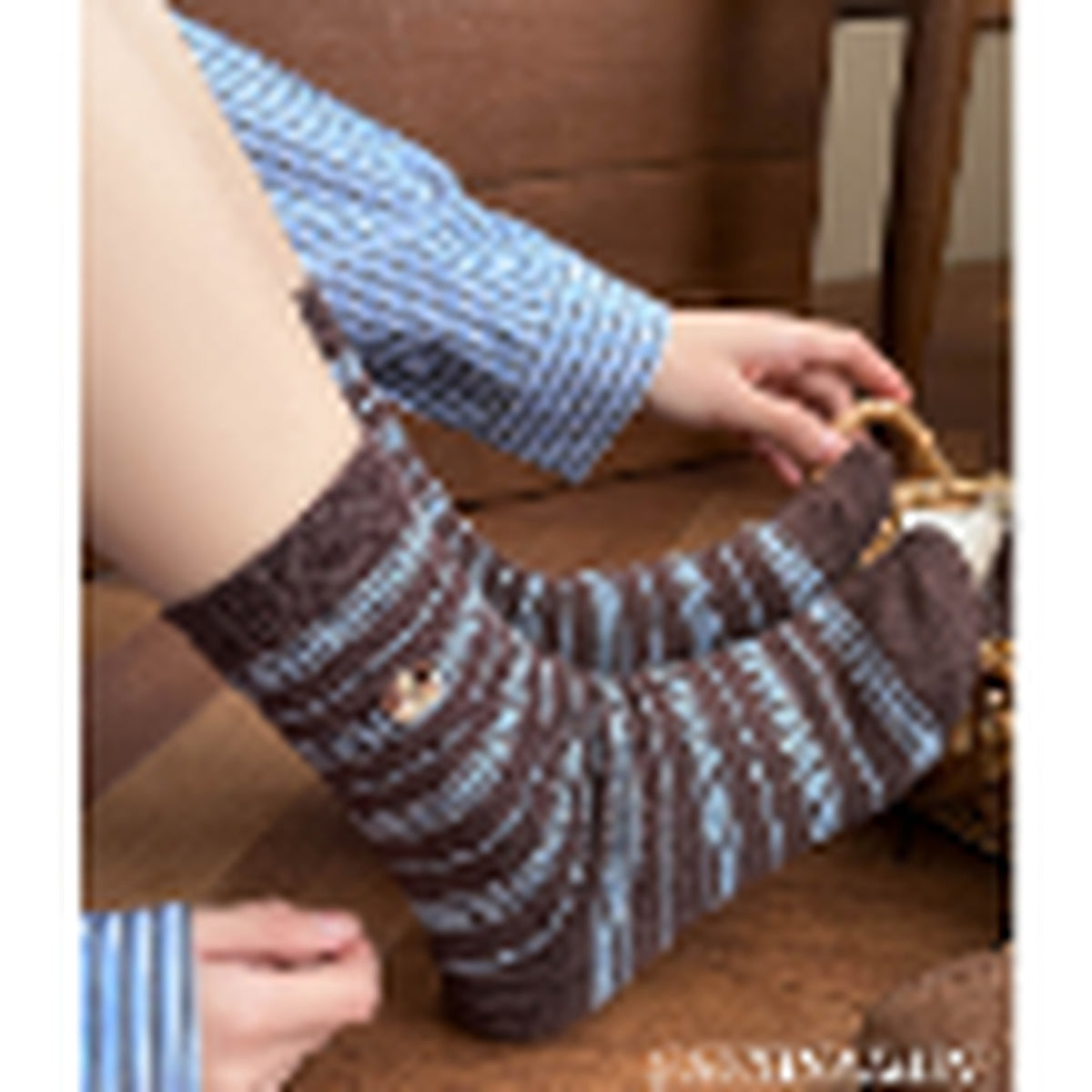 Blue and brown striped slouch socks worn on foot
