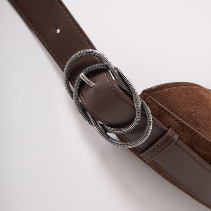 Custom ouroboros metal buckle detail on CRESCENT bag strap