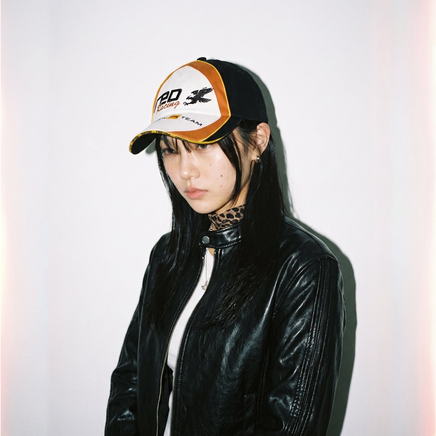 Side view of HORIZON color-block racing cap on model