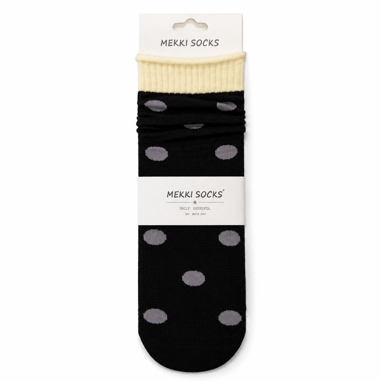 Black polka-dot cotton slouch socks with cream rolled cuff