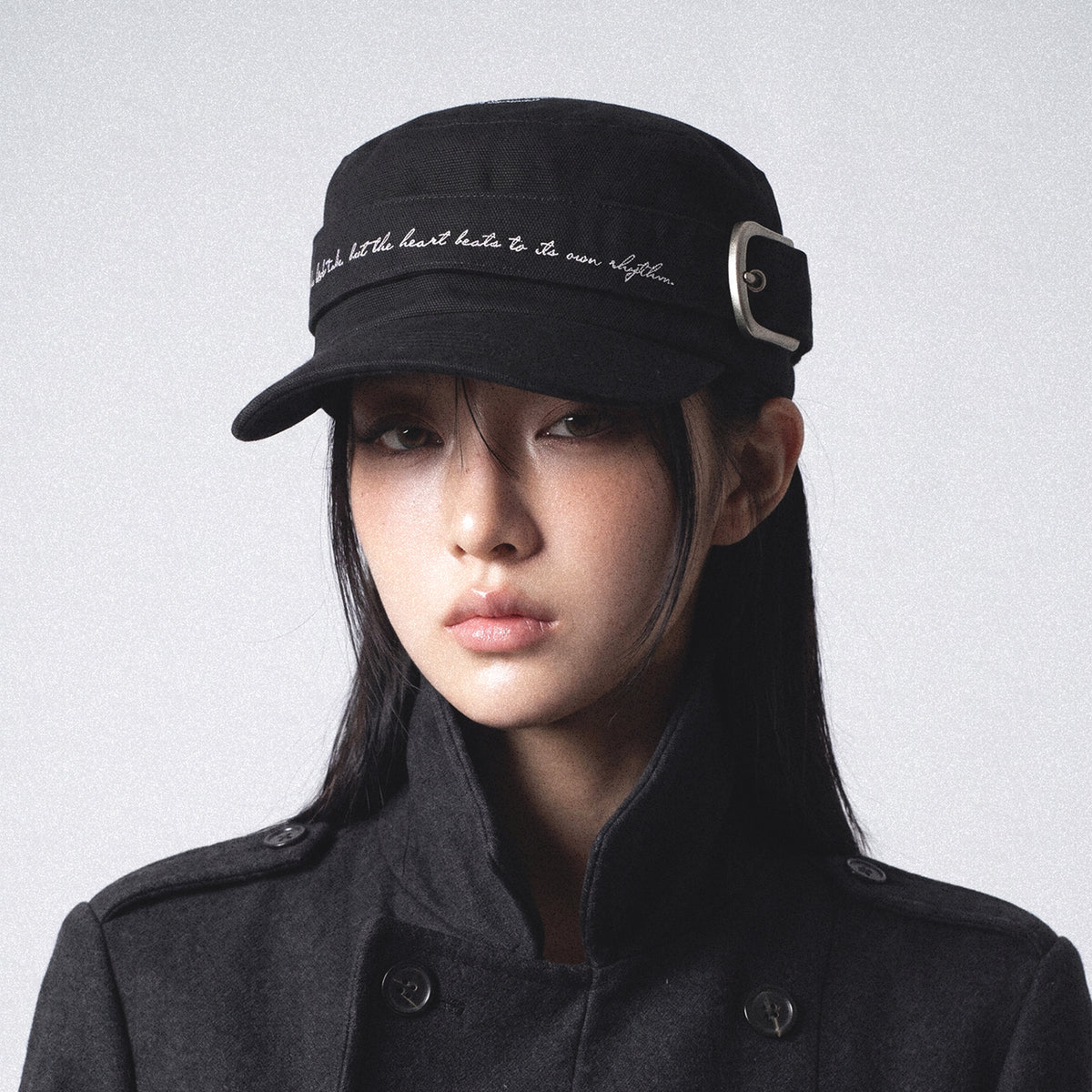Black RHYTHM flat-top cap styled on model front view