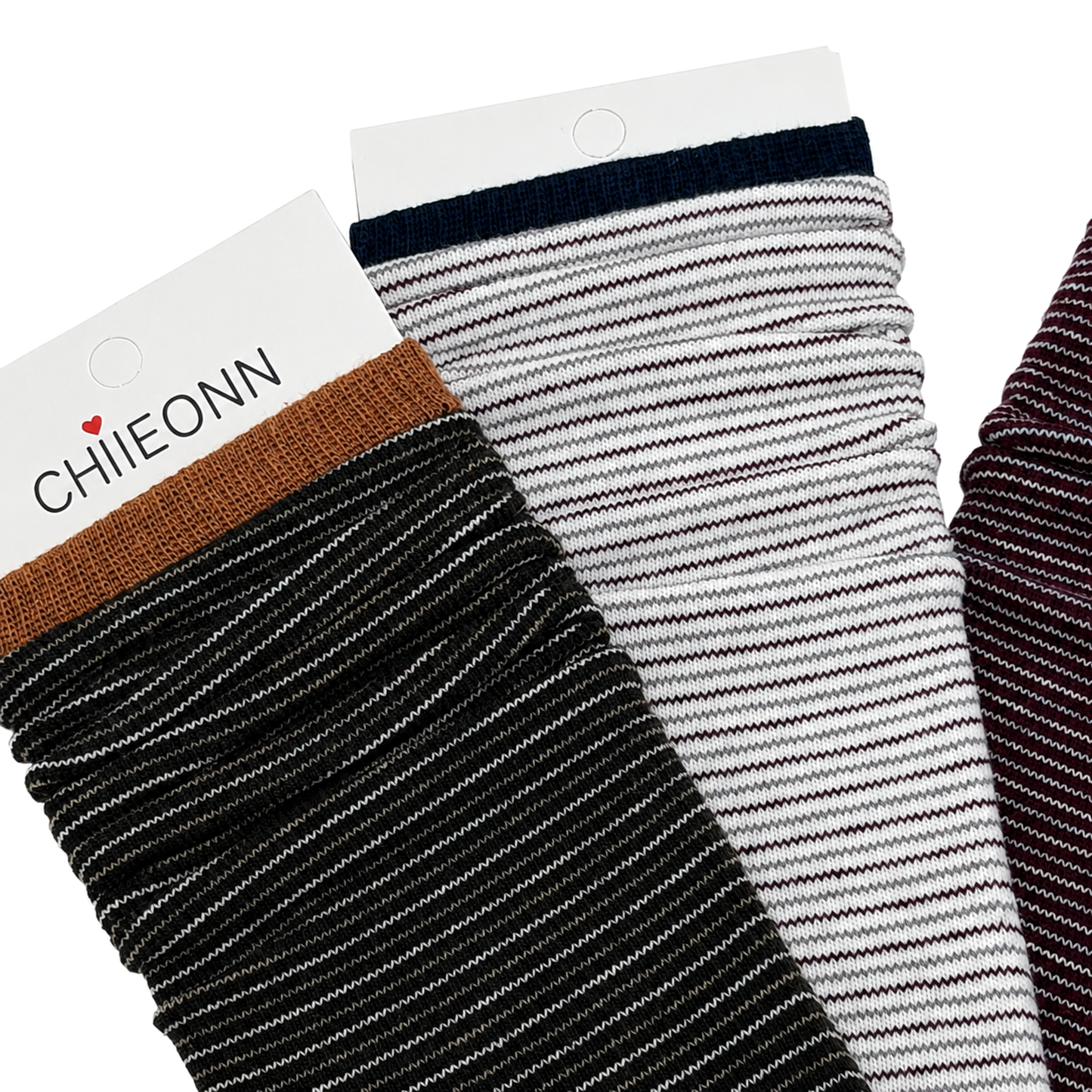 Close-up of black, ivory and burgundy micro-stripe socks on pure white