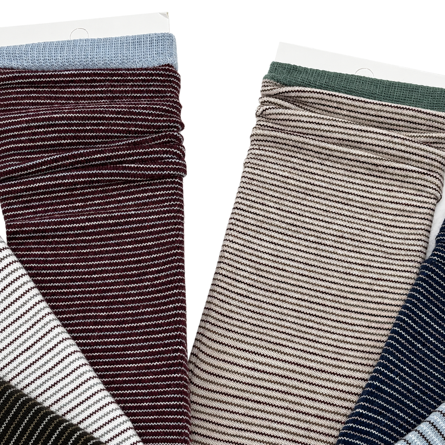 Close-up of burgundy, beige and navy striped socks on pure white