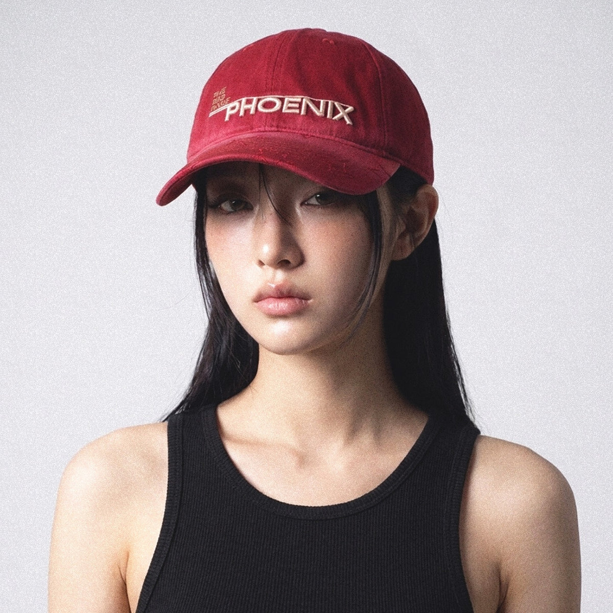 Model wearing the SUNBURN red star embroidered cap angled view